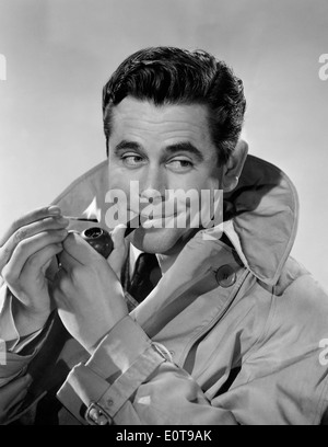 Glenn Ford, pubblicità ritratto, sul set del film "Gallant viaggio", 1946 Foto Stock