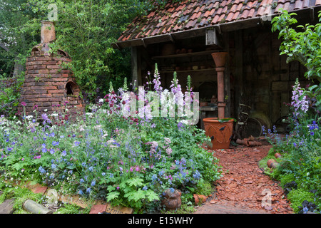 RHS Chelsea flower show 2014 - Il quadrante di un volo - Potter's Garden - Progettista Di natura ridisegnato - Sponsor DialAFlight Foto Stock