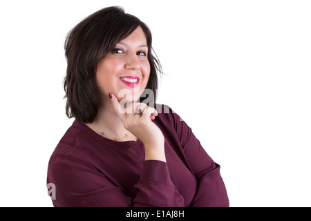 Persone di mezza età imprenditrice in camicia guardando i tuoi occhi sorridenti e positivamente con il suo dito indice sul suo mento Foto Stock