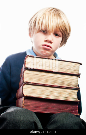 Scuola infelice ragazzo con la sua scuola di libri Foto Stock