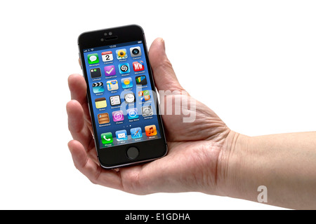 Iphone in una mano di donna Foto Stock
