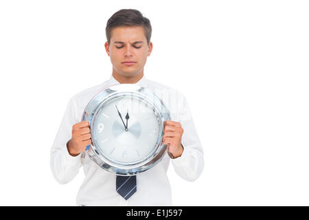 Imprenditore di detenzione e guardando orologio Foto Stock