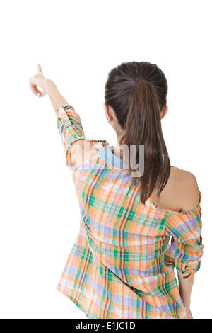 Donna asiatica punti con il dito su qualcosa di Foto Stock