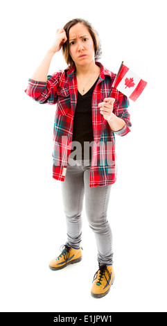 Confuso donna con holding Canada bandiera Foto Stock