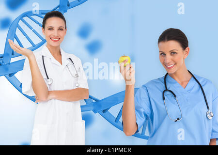 Immagine composita di felice femmina team medici Foto Stock