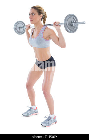 Femmina forte sollevamento crossfitter barbell dietro la testa Foto Stock