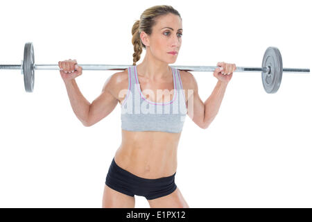 Femmina forte sollevamento crossfitter barbell dietro la testa Foto Stock