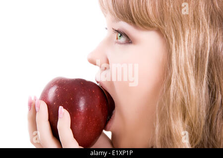 La ragazza morde un Apple Foto Stock