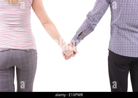 Giovane uomo e la donna a tenere per le mani Foto Stock