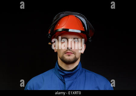 Il lavoratore in tute da lavoro Foto Stock