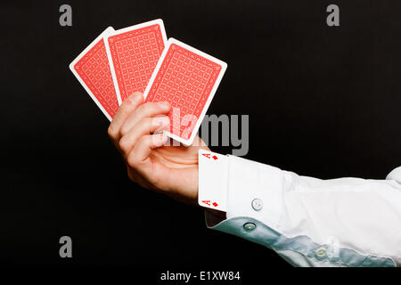 Carte da gioco e un asso nel foro Foto Stock