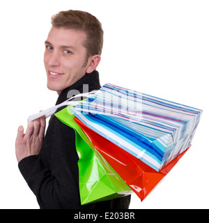 Sorridente giovane con le borse della spesa, isolato su bianco Foto Stock