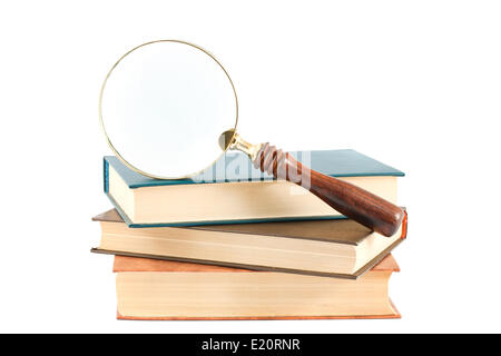 Lente di ingrandimento e libri Foto Stock