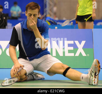 Tokyo, Giappone. Xiii Giugno, 2014. Hans-Kristian Vittinghus della Danimarca reagisce durante gli Uomini Singoli Quarti di Overgrip Yonex Open Giappone 2014 contro il Giappone del Tago Kenichi in Tokyo, Giappone, 13 giugno 2014. Tago Kenichi ha vinto 2-1. © Stringer/Xinhua/Alamy Live News Foto Stock