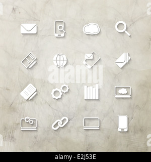 Icone bianche impostato su parete testurizzata sfondo Foto Stock