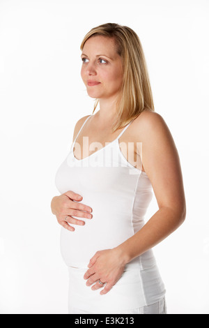 Studio Ritratto Di Donna Incinta bianco da indossare Foto Stock