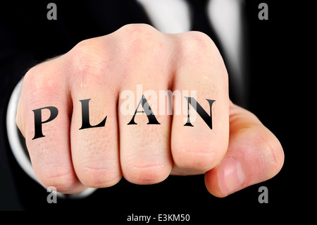 Parola del piano sul business man pugno Foto Stock