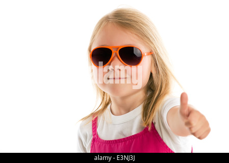 La bambina che mostra pollice in alto Foto Stock