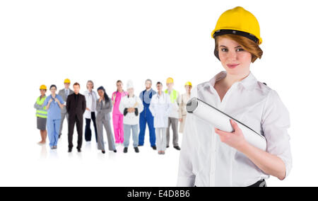 Immagine composita della bella giovane architetto sorridente in telecamera Foto Stock