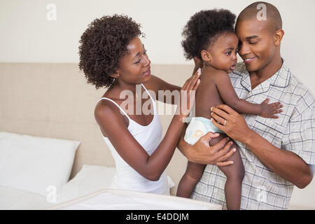 Genitori felici con la loro bambina Foto Stock