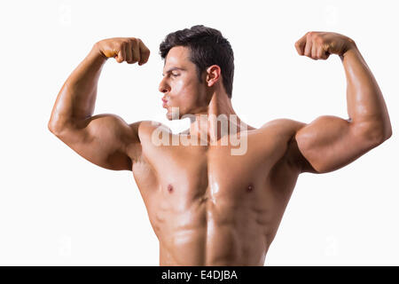 Ritratto di un giovane muscolare uomo muscoli di flessione Foto Stock