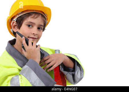 Ragazzo che finge di essere una guardia del traffico Foto Stock