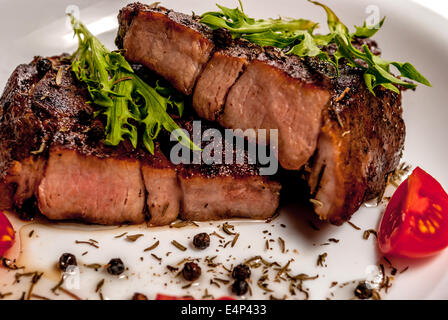 Collo di maiale bistecca con verdure e pepe Foto Stock