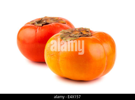 Due maturi frutti persimmon Foto Stock