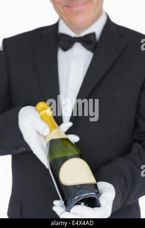 Cameriere che offre champagne Foto Stock