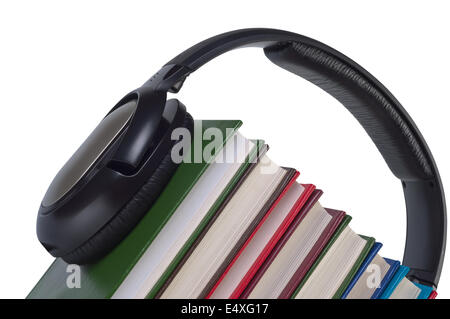 Cuffie su libri close up. Foto Stock