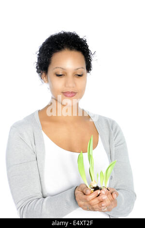 Afro-americani giovane donna in possesso di un impianto Foto Stock