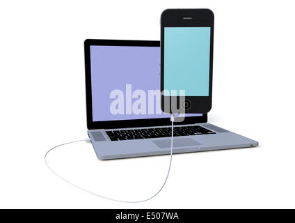 Un laptop è collegato con un telefono Foto Stock