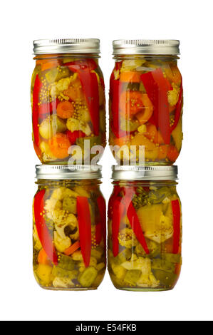 Four jars of pickled vegetables isolated Foto Stock