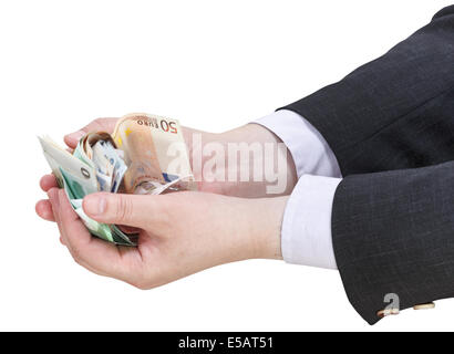 Pila di banconote in euro in imprenditore manciata isolati su sfondo bianco Foto Stock