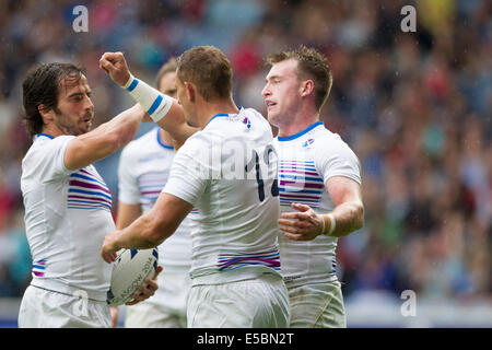 Glasgow, Scozia. 26 Luglio, 2014. Glasgow Giochi del Commonwealth. Scozia Colin Shaw celebra con un punteggio provare con i suoi compagni di squadra, Scozia rispetto a Barbados nel Rugby 7's da Ibrox Stadium. Credito: Azione Sport Plus/Alamy Live News Foto Stock