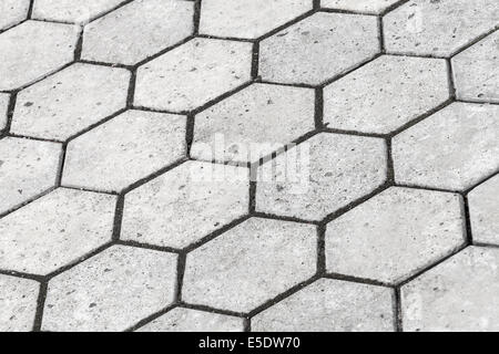 Texture di sfondo di colore grigio a forma di nido d'ape strada acciottolata Foto Stock