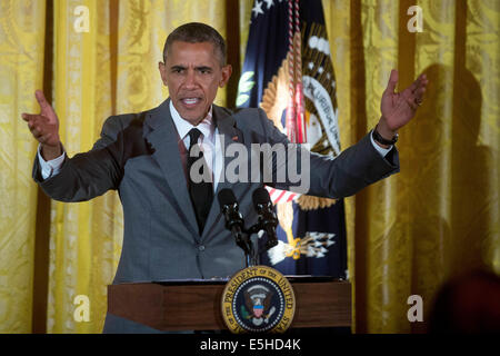 Washington, DC, Stati Uniti d'America. 31 Luglio, 2014. Il Presidente Usa Barack Obama parla a un evento dal titolo "Una celebrazione delle Olimpiadi speciali e di un sistema unificato di nuova generazione in occasione del primo anniversario delle Olimpiadi speciali nella Sala Est della Casa Bianca di Washington, DC, Stati Uniti d'America, 31 luglio 2014. Fondata nel 1968 da Eunice Kennedy Shriver, le Olimpiadi speciali il movimento è cresciuto di oltre 4,4 milioni di atleti in 170 paesi. EPA/Andrew Harrer/Piscina via CNP - nessun filo SERVICE - © dpa/Alamy Live News Foto Stock