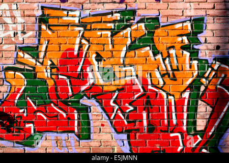 Urban graffiti su muro in mattoni di close-up Foto Stock