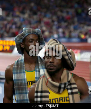 Glasgow. 2 agosto, 2014. Gli atleti della Giamaica reagire dopo che gli uomini 4x100m finale del relè di atletica a 2014 Glasgow Giochi del Commonwealth in Hampden Park a Glasgow in Scozia il 2 agosto 2014. La Giamaica ha vinto la medaglia d'oro con un tempo di 37.58 secondi. Credito: Han Yan/Xinhua/Alamy Live News Foto Stock