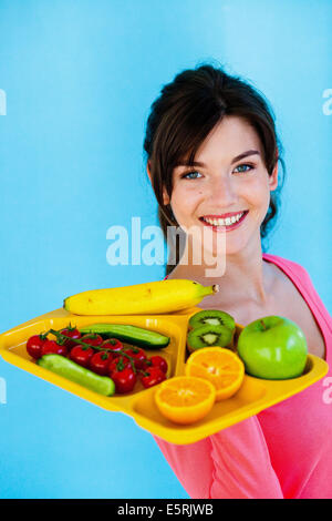 Illustrazione di mangiare cinque frutti e verdure al giorno come raccomandato dal sistema nazionale di sanità e nutrizione programma (NHNP). Foto Stock