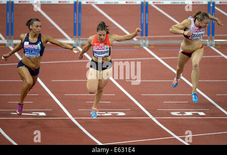 Zurigo, Svizzera. 12 Ago, 2014. Cindy Billaud dalla Francia (da sinistra a destra), Nadine Hildebrand dalla Germania e Noemi Zbaeren dalla Svizzera competere in donne 100m ostacoli semifinale, il primo giorno del Campionato Europeo di Atletica in Letzigrund a Zurigo, Svizzera, 12 agosto 2014. Foto: Rainer Jensen/dpa/Alamy Live News Foto Stock