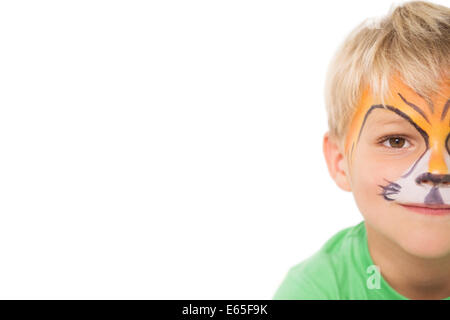 Happy little boy in tiger face paint Foto Stock