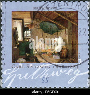 Germania - circa 2008: francobollo stampato in Germania, mostra il dipinto "Il poeta povero' da Carl Spitzweg, circa 2008 Foto Stock