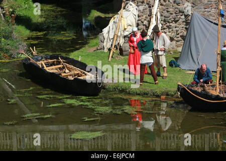 Curragh e contadini medievale Foto Stock