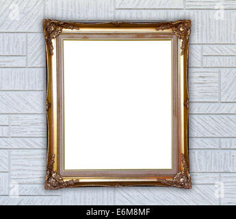 Blank cornice dorata sulla parete moderna sullo sfondo Foto Stock