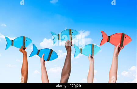 Persone azienda simboli pesce e concetto di Leadership Foto Stock