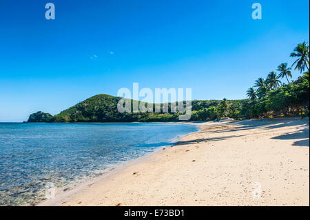 Spiaggia di sabbia bianca sulla Korovou Eco-Tour Resort, Naviti, Yasawas, Figi, South Pacific Pacific Foto Stock