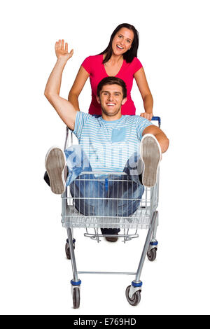 Coppia giovane divertendosi con carrello Foto Stock