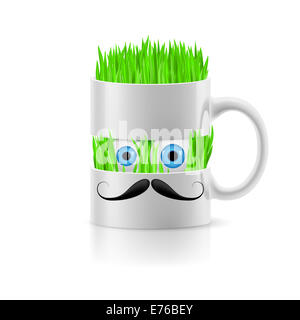 Tazza bianca di due parti con baffi di erba e due occhi all'interno. Foto Stock