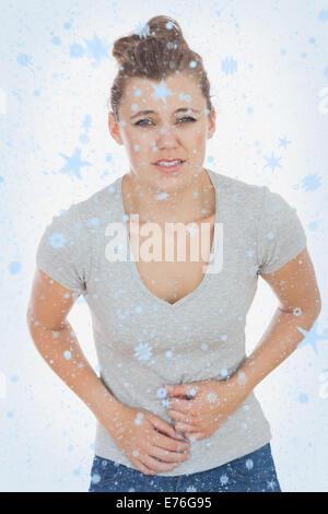 Immagine composita della donna che soffre di dolori di stomaco Foto Stock